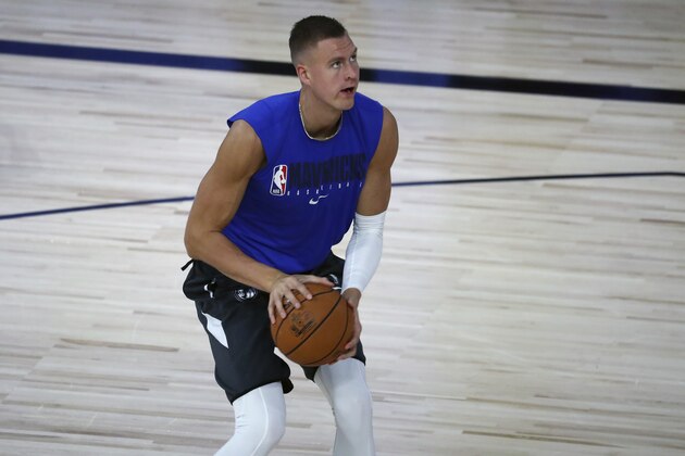 Dallas Mavericks forward Kristaps Porzingis warms up before an NBA basketball game against the Sacramento Kings, Tuesday, Aug. 4, 2020, in Lake Buena Vista, Fla. (Kim Klement/Pool Photo via AP)