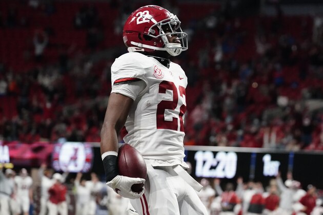 Alabama running back Najee Harris (22) celebrates his touchdown against Florida during the first half of the Southeastern Conference championship NCAA college football game, Saturday, Dec. 19, 2020, in Atlanta. (AP Photo/Brynn Anderson)