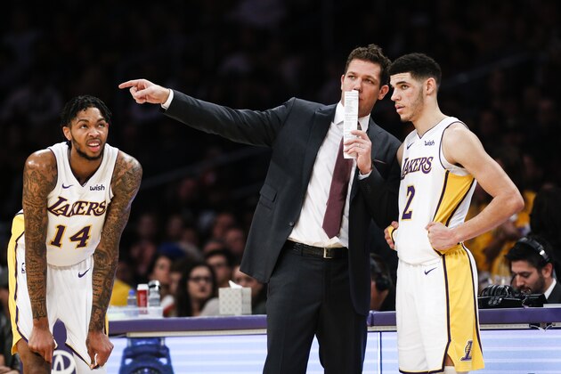 Los Angeles Lakers forward Brandon Ingram #14, looks on as head coach Luke Walton talks to guard Lonzo Ball #2 during the first half of an NBA basketball game Sunday, Nov. 19, 2017, in Los Angeles. (AP Photo/Ringo H.W. Chiu)