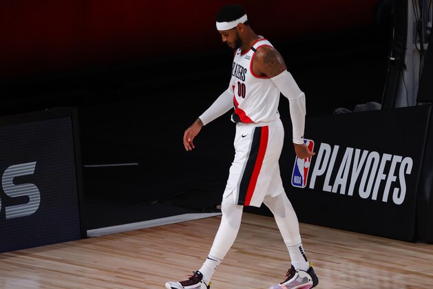 Portland Trail Blazers' Carmelo Anthony leaves the court at halftime during Game 4 of an NBA basketball first-round playoff series against the Los Angeles Lakers, Monday, Aug. 24, 2020, in Lake Buena Vista, Fla. (Kevin C. Cox/Pool Photo via AP)
