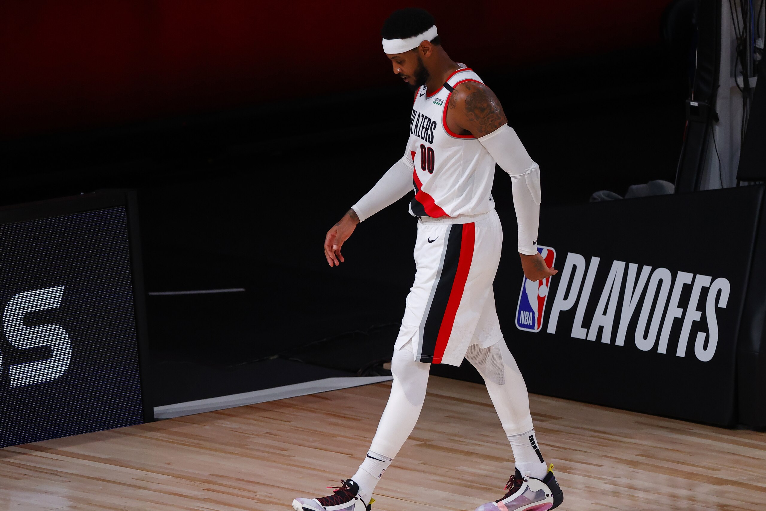 Portland Trail Blazers' Carmelo Anthony leaves the court at halftime during Game 4 of an NBA basketball first-round playoff series against the Los Angeles Lakers, Monday, Aug. 24, 2020, in Lake Buena Vista, Fla. (Kevin C. Cox/Pool Photo via AP)