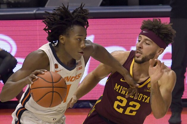 Illinois guard Ayo Dosunmu (11) powers past Minnesota's guard Gabe Kalscheur (22) in the second half of an NCAA college basketball game Tuesday, Dec. 15, 2020, in Champaign, Ill. (AP Photo/Holly Hart) Illinois guard Ayo Dosunmu (11) powers past Minnesota's guard Gabe Kalscheur (22) in the second half of an NCAA college basketball game Tuesday, Dec. 15, 2020, in Champaign, Ill. (AP Photo/Holly Hart)