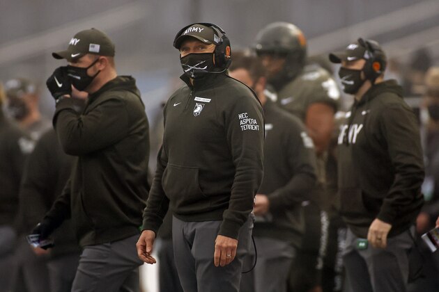 Army head coach Jeff Monken looks on against Navy during the first half of an NCAA college football game Saturday, Dec. 12, 2020, in West Point, N.Y. It was the 121st playing of the Army-Navy game played in Michie Stadium at the United States Military Academy. Army defeated Navy 15-0. (AP Photo/Adam Hunger) Army head coach Jeff Monken looks on against Navy during the first half of an NCAA college football game Saturday, Dec. 12, 2020, in West Point, N.Y. It was the 121st playing of the Army-Navy game played in Michie Stadium at the United States Military Academy. Army defeated Navy 15-0. (AP Photo/Adam Hunger)
