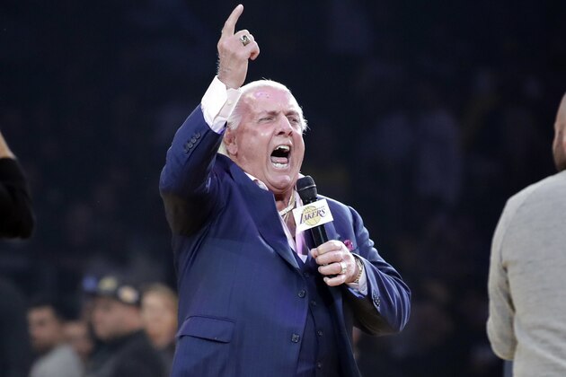 Wrestler Ric Flair addresses the crowd before an NBA basketball game between the Los Angeles Lakers and the New Orleans Pelicans Tuesday, Feb. 25, 2020, in Los Angeles. (AP Photo/Marcio Jose Sanchez) Wrestler Ric Flair addresses the crowd before an NBA basketball game between the Los Angeles Lakers and the New Orleans Pelicans Tuesday, Feb. 25, 2020, in Los Angeles. (AP Photo/Marcio Jose Sanchez)