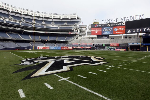 The Army logo is painted on a football field at Yankee Stadium ahead of the Army-Rutgers NCAA college football game, Thursday, Nov. 10, 2011 in New York.  The two teams are scheduled to play on Saturday. (AP Photo/Mary Altaffer)