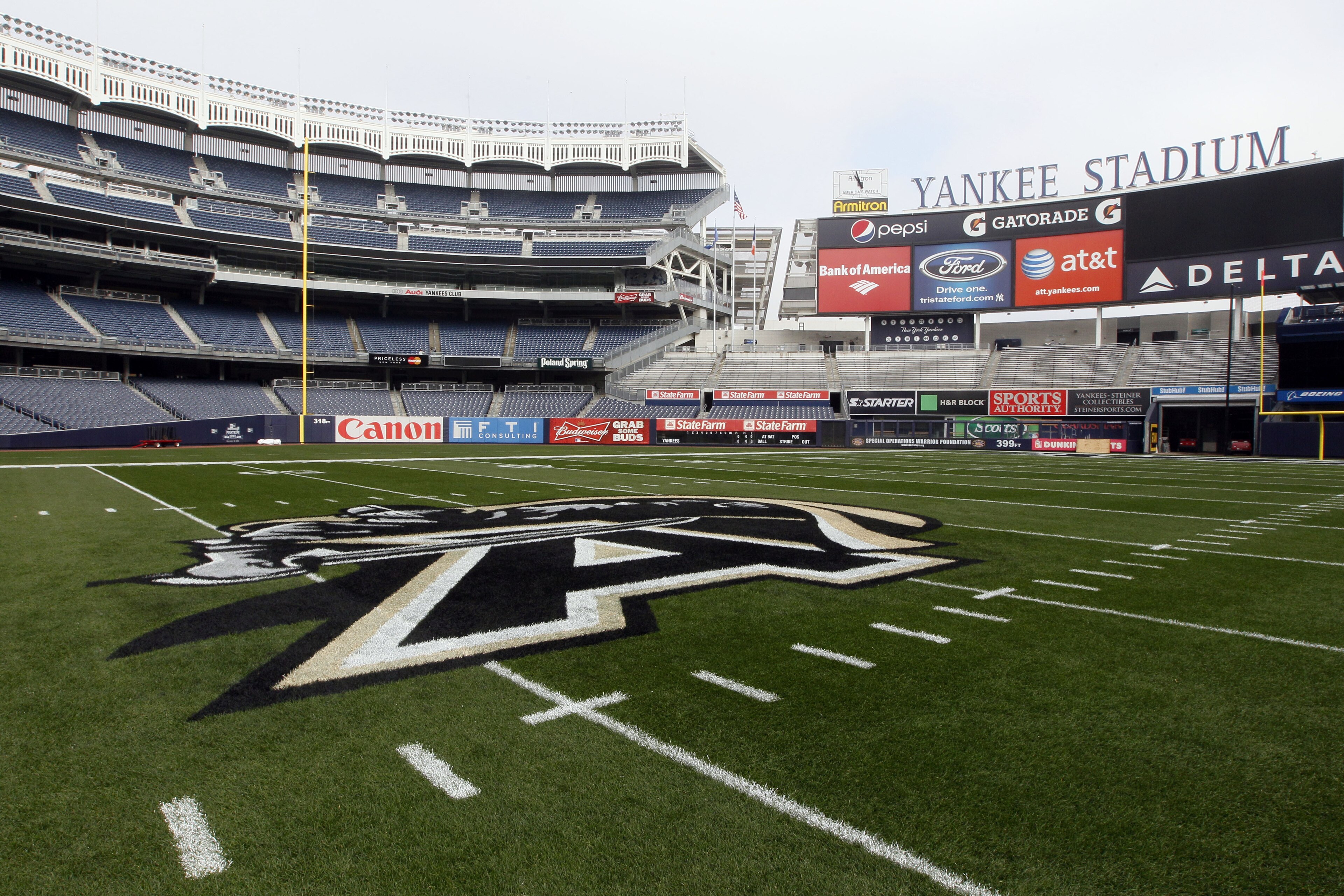The Army logo is painted on a football field at Yankee Stadium ahead of the Army-Rutgers NCAA college football game, Thursday, Nov. 10, 2011 in New York.  The two teams are scheduled to play on Saturday. (AP Photo/Mary Altaffer)