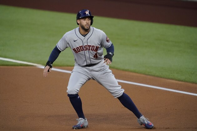 Houston Astros' George Springer takes a lead off of first in the first inning of a baseball game against the Texas Rangers in Arlington, Texas, Friday, Sept. 25, 2020. (AP Photo/Tony Gutierrez)