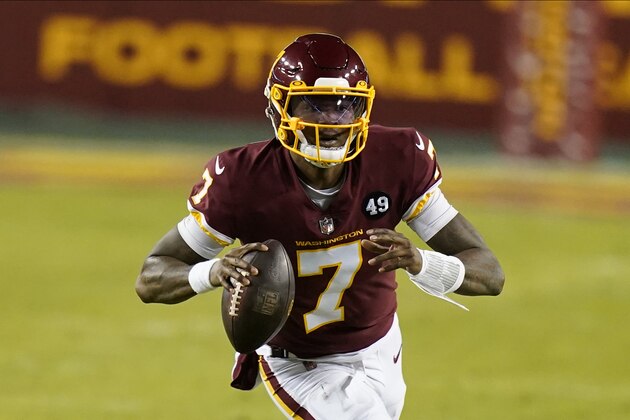 Washington Football Team quarterback Dwayne Haskins (7) runs with the ball during the first half of an NFL football game against the Carolina Panthers, Sunday, Dec. 27, 2020, in Landover, Md. (AP Photo/Carolyn Kaster)