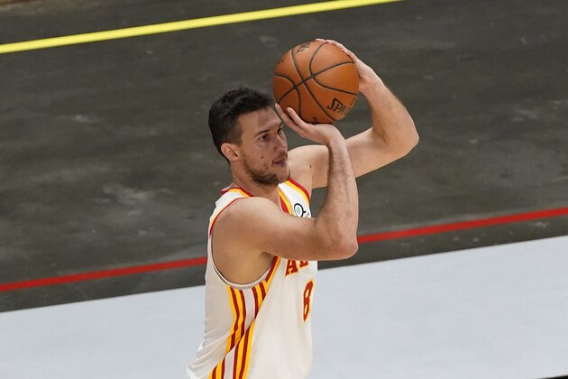Atlanta Hawks forward Danilo Gallinari (8) shoots against the Orlando Magic during the second half of an NBA basketball game Sunday, Dec. 13, 2020, in Atlanta. (AP Photo/John Bazemore)