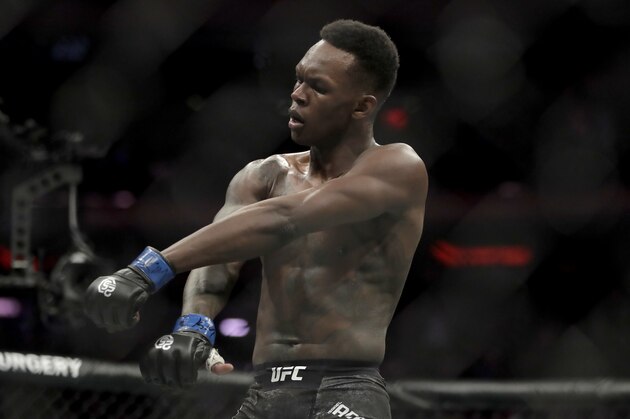 Israel Adesanya reacts after defeating Derek Brunson during the first round of a middleweight mixed martial arts bout at UFC 230, Saturday, Nov. 3, 2018, at Madison Square Garden in New York. (AP Photo/Julio Cortez)