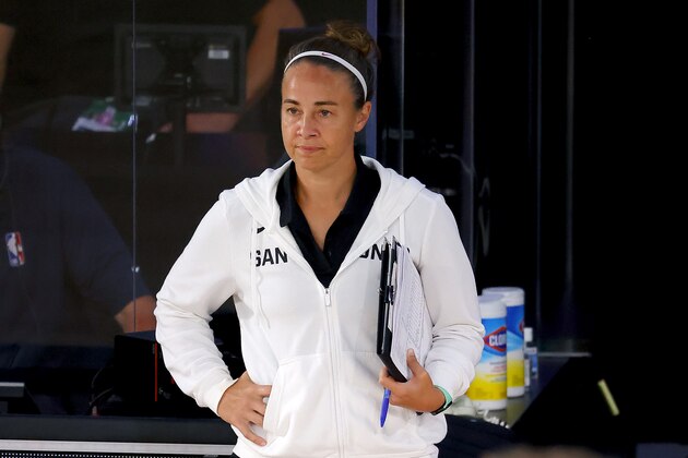 San Antonio Spurs assistant coach Becky Hammon of the San Antonio Spurs looks on against the Philadelphia 76ers during the second half of an NBA basketball game Monday, Aug. 3, 2020, in Lake Buena Vista, Fla. (Mike Ehrmann/Pool Photo via AP)