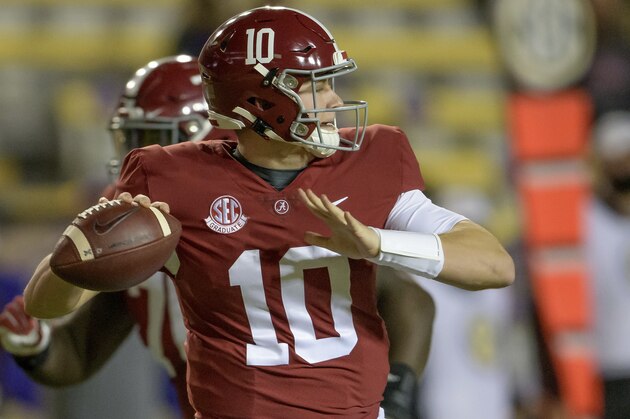 FILE - In this Dec. 5, 2020, file photo, Alabama quarterback Mac Jones (10) throws during the first half of an NCAA college football game against LSU in Baton Rouge, La. (AP Photo/Matthew Hinton, File)