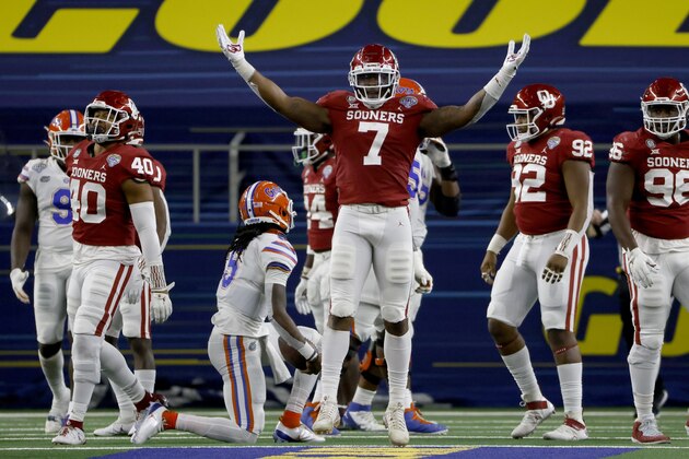 Oklahoma defensive end Ronnie Perkins (7) celebrates after sacking Florida quarterback Emory Jones, center left on knee, during the second half of the Cotton Bowl NCAA college football game in Arlington, Texas, Wednesday, Dec. 30, 2020. (AP Photo/Ron Jenkins)