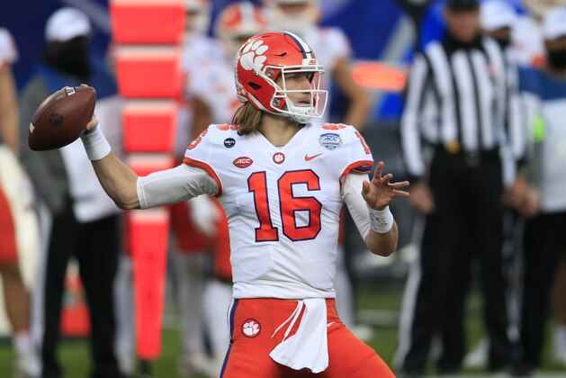 FILE - In this Saturday, Dec. 19, 2020, file photo, Clemson quarterback Trevor Lawrence (16) looks for a receiver during the first half of the Atlantic Coast Conference championship NCAA college football game against Notre Dame in Charlotte, N.C. (AP Photo/Brian Blanco, File)