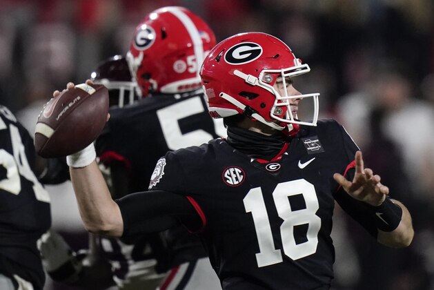Georgia quarterback JT Daniels (18) sets back to pass against Mississippi State during the second half of an NCAA college football game, Saturday, Nov. 21, 2020, in Athens, Ga. (AP Photo/Brynn Anderson)