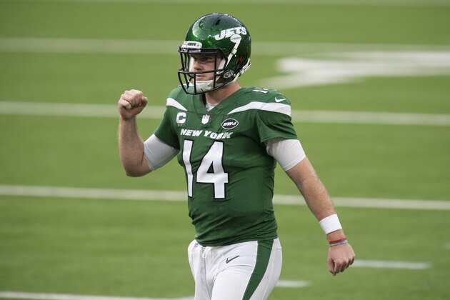 New York Jets quarterback Sam Darnold (14) pumps his fist after running back Frank Gore (21) scores a touchdown during an NFL football game against the Los Angeles Rams Sunday, Dec. 20, 2020, in Inglewood, Calif. (AP Photo/Kyusung Gong)