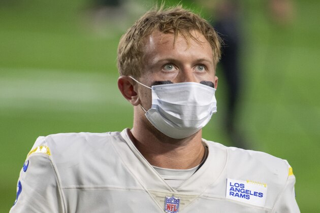 Los Angeles Rams quarterback John Wolford (9) reacts while walking off the field after an NFL football game against the Arizona Cardinals, Sunday, Dec. 6, 2020, in Glendale, Ariz. (AP Photo/Jennifer Stewart)