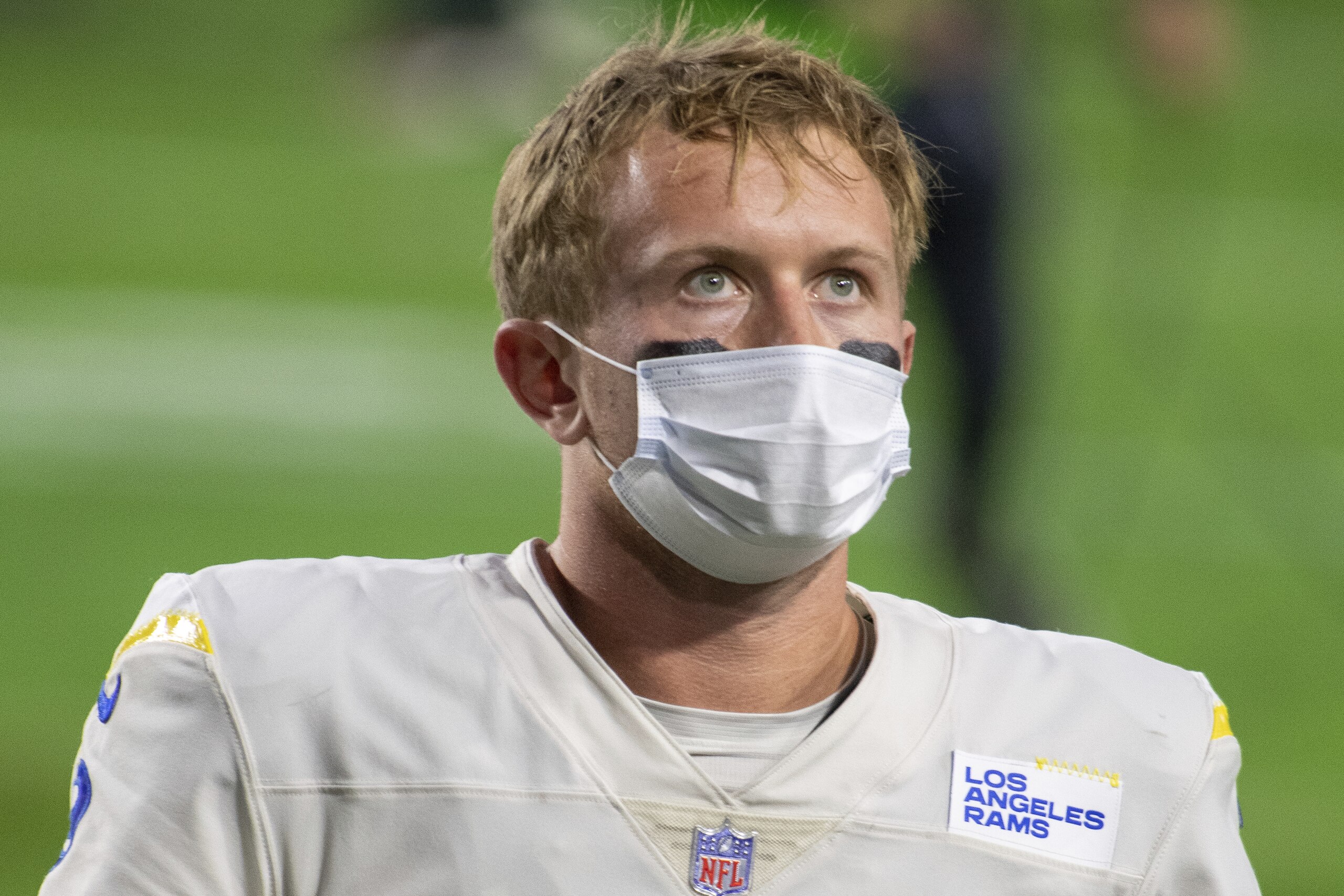 Los Angeles Rams quarterback John Wolford (9) reacts while walking off the field after an NFL football game against the Arizona Cardinals, Sunday, Dec. 6, 2020, in Glendale, Ariz. (AP Photo/Jennifer Stewart)