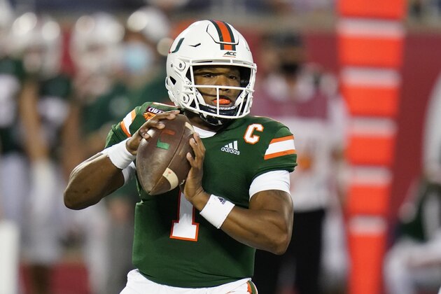 Miami quarterback D'Eriq King looks for a receiver against Oklahoma State during the first half of the Cheez-it Bowl NCAA college football game, Tuesday, Dec. 29, 2020, in Orlando, Fla. (AP Photo/John Raoux)