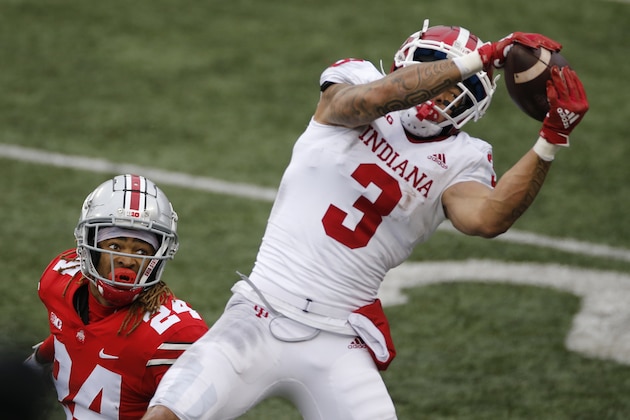 Indiana receiver Ty Fryfogle, right, catches a pass for a touchdown over Ohio State defensive back Shaun Wade during the second half of an NCAA college football game Saturday, Nov. 21, 2020, in Columbus, Ohio. Ohio State beat Indiana 42-35. (AP Photo/Jay LaPrete)