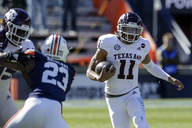 Texas A&M quarterback Kellen Mond (11) carries the ball against Auburn during the first half of an NCAA college football game on Saturday, Dec. 5, 2020, in Auburn, Ala. (AP Photo/Butch Dill)