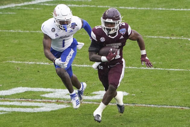 Mississippi State running back Jo'Quavious Marks (21) runs past Tulsa safety Kendarin Ray (1) for a touchdown during the first half of the Armed Forces Bowl NCAA college football game Thursday, Dec. 31, 2020, in Fort Worth, Texas. (AP Photo/Jim Cowsert)