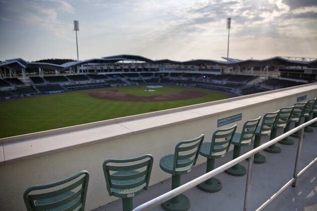 The sun sets over JetBlue Park at Fenway South, the spring training ballpark of the Boston Red Sox baseball team, in Fort Myers, Fla., Monday, Feb. 13, 2017. (AP Photo/David Goldman)