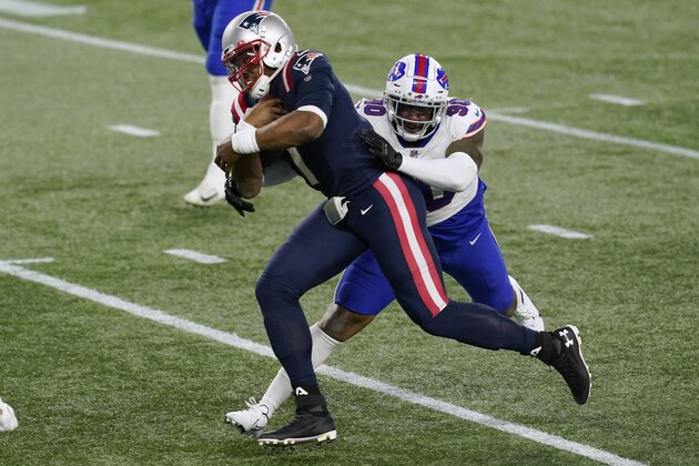 New England Patriots quarterback Cam Newton breaks free from Buffalo Bills defensive tackle Quinton Jefferson (90) on his way to a touchdown in the first half of an NFL football game, Monday, Dec. 28, 2020, in Foxborough, Mass. (AP Photo/Elise Amendola)