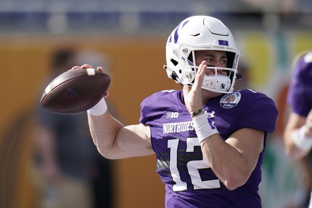 Northwestern quarterback Peyton Ramsey warms up before the Citrus Bowl NCAA college football game against Auburn, Friday, Jan. 1, 2021, in Orlando, Fla. (AP Photo/John Raoux)