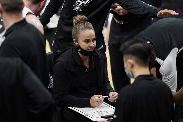 San Antonio Spurs assistant coach Becky Hammon calls a play during a timeout in the second half of the team's NBA basketball game against the Los Angeles Lakers in San Antonio, Wednesday, Dec. 30, 2020. (AP Photo/Eric Gay)