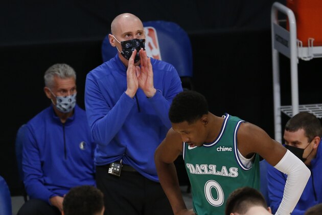 Dallas Mavericks head coach Rick Carlisle wearing a face mask stands courtside during the first half of an NBA basketball game against the Los Angeles Lakers Friday, Dec. 25, 2020, in Los Angeles. (AP Photo/Ringo H.W. Chiu)
