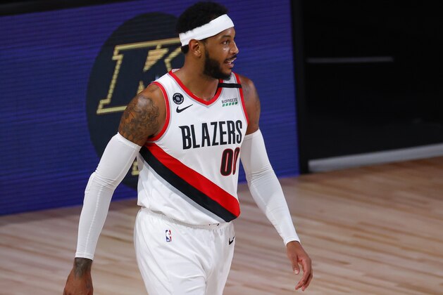 Portland Trail Blazers' Carmelo Anthony reacts after being charged with an offensive foul against the Los Angeles Lakers in Game 4 of an NBA basketball first-round playoff series, Monday, Aug. 24, 2020, in Lake Buena Vista, Fla. (Kevin C. Cox/Pool Photo via AP)