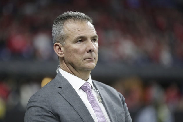 Former Ohio State head coach Urban Meyer watches during the second half of the Big Ten championship NCAA college football game between Ohio State and Wisconsin, Saturday, Dec. 7, 2019, in Indianapolis. (AP Photo/Michael Conroy)