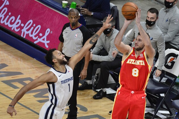 Atlanta Hawks forward Danilo Gallinari (8) shoots against Memphis Grizzlies forward Kyle Anderson (1) in the second half of an NBA preseason basketball game Saturday, Dec. 19, 2020, in Memphis, Tenn. (AP Photo/Brandon Dill)