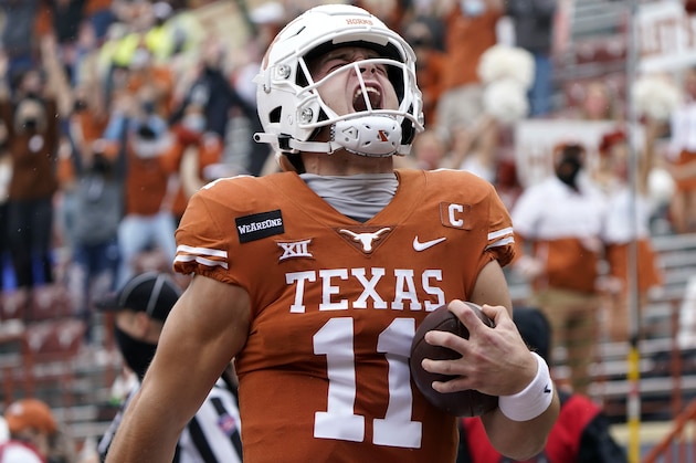 Texas quarterback Sam Ehlinger (11) reacts as he runs for a 17-yard touchdown against Iowa State during the first half of an NCAA college football game, Friday, Nov. 27, 2020, in Austin, Texas. (AP Photo/Eric Gay)