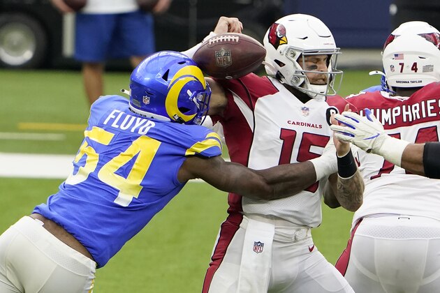Arizona Cardinals quarterback Chris Streveler (15) fumbles the ball as he is hit by Los Angeles Rams outside linebacker Leonard Floyd (54) during the first half of an NFL football game in Inglewood, Calif., Sunday, Jan. 3, 2021. The Cardinals recovered the ball. (AP Photo/Jae C. Hong)