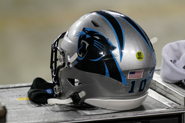 Carolina Panthers helmet sits on the bench during an NFL football game between the Carolina Panthers and the Washington Football Team, Sunday, Dec. 27, 2020, in Landover, Md. (AP Photo/Mark Tenally)
