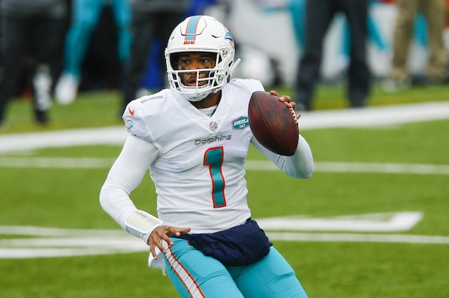 Miami Dolphins quarterback Tua Tagovailoa (1) looks to pass on the run in the first half of an NFL football game against the Buffalo Bills, Sunday, Jan. 3, 2021, in Orchard Park, N.Y. (AP Photo/John Munson)