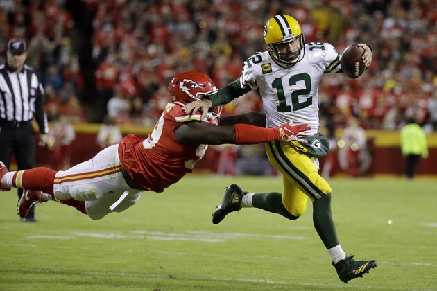 Green Bay Packers quarterback Aaron Rodgers (12) is tackled by Kansas City Chiefs defensive tackle Khalen Saunders (99) during the second half of an NFL football game against the Kansas City Chiefs in Kansas City, Mo., Sunday, Oct. 27, 2019. (AP Photo/Charlie Riedel)