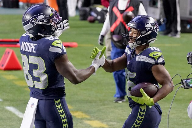 Seattle Seahawks wide receiver Tyler Lockett (16) celebrates his touchdown during the second half of an NFL football game against the San Francisco 49ers with wide receiver David Moore (83) , Sunday, Jan. 3, 2021, in Glendale, Ariz. (AP Photo/Ross D. Franklin)