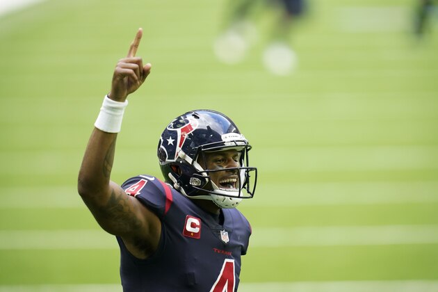 Houston Texans quarterback Deshaun Watson (4) smiles as he celebrates a touchdown as he points skyward with his index finger during an NFL football game against the Cincinnati Bengals, Sunday, Dec. 27, 2020, in Houston. (AP Photo/Matt Patterson)