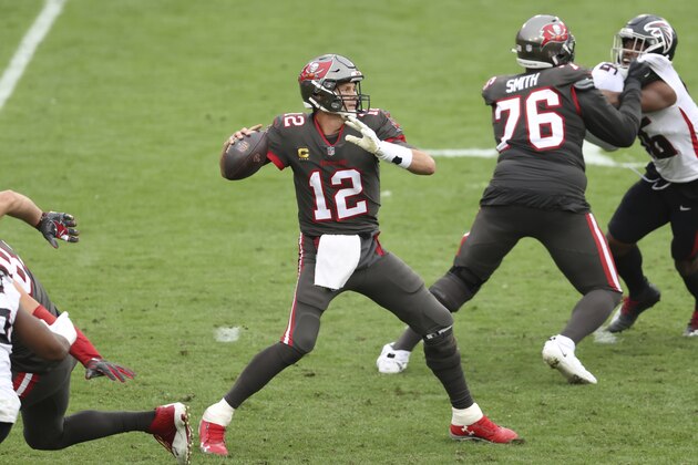 Tampa Bay Buccaneers quarterback Tom Brady (12) fires a pass against the Atlanta Falcons during the second half of an NFL football game Sunday, Jan. 3, 2021, in Tampa, Fla. (AP Photo/Mark LoMoglio)