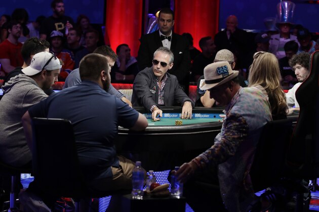 Damian Salas, center, of Argentina, competes during the main event of the World Series of Poker, Thursday, July 20, 2017, in Las Vegas. (AP Photo/John Locher)