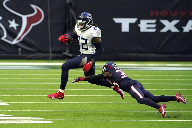 Tennessee Titans running back Derrick Henry (22) avoids Houston Texans cornerback Keion Crossen (35) during the first half of an NFL football game Sunday, Jan. 3, 2021, in Houston. (AP Photo/Eric Christian Smith)