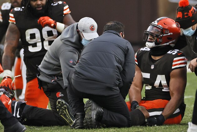 Cleveland Browns defensive end Olivier Vernon (54) grimaces after an injury during the second half of an NFL football game against the Pittsburgh Steelers, Sunday, Jan. 3, 2021, in Cleveland. (AP Photo/Ron Schwane)