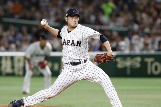 FILE - In this March 14, 2017, file photo, Japan starting pitcher Tomoyuki Sugano throws to a Cuba batter during the first inning of a second-round game at the World Baseball Classic in Tokyo. Sugano was named to start agains the United State in a Tuesday night, March 21, semifinal in the tournament. (AP Photo/Toru Takahashi, File)