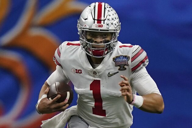 Ohio State quarterback Justin Fields runs against Clemson during the first half of the Sugar Bowl NCAA college football game Friday, Jan. 1, 2021, in New Orleans. (AP Photo/Gerald Herbert)
