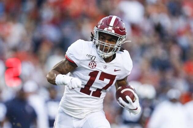 Alabama wide receiver Jaylen Waddle (17) carries the ball against Auburn during an NCAA college football game Saturday, Nov. 30, 2019, in Auburn, Ala. (AP Photo/Butch Dill)