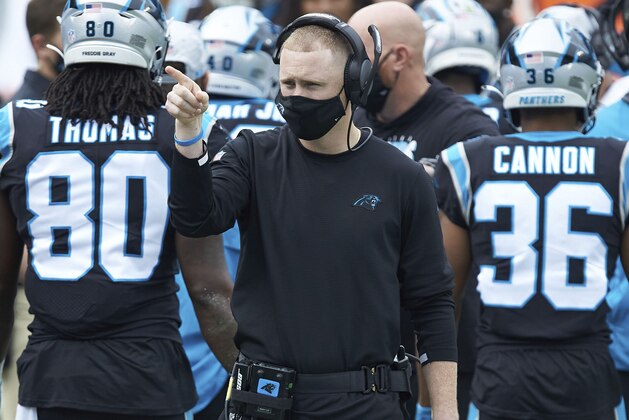 Carolina Panthers offensive coordinator Joe Brady watches from the sideline during an NFL football game against the Detroit Lions, Sunday, Nov. 22, 2020, in Charlotte, N.C. (AP Photo/Brian Westerholt)