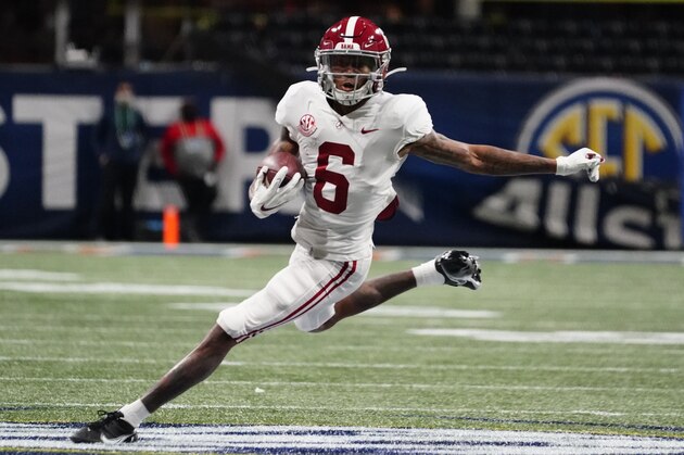 FILE - In this Saturday, Dec. 19, 2020, file photo, Alabama wide receiver DeVonta Smith (6) runs against Florida during the first half of the Southeastern Conference championship NCAA college football game in Atlanta. Smith has been named a finalist for the Heisman Trophy. The Heisman will be awarded Jan. 5 during a virtual ceremony as the pandemic forced the cancellation of the usual trip to New York that for the presentation that usually comes with being a finalist.  (AP Photo/Brynn Anderson, File)